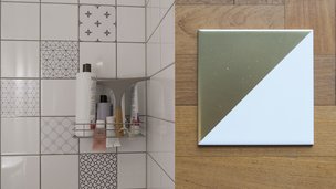 Fliser med klistermærker pynter i hvid brusekabine og flise med spraymaling som bordskåner. 