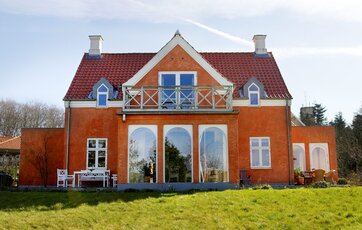 Hus hvor facaden er blevet pudset og har fået en overfladebehandling